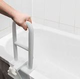 Person holding the Vaunn bathtub safety rail in the tub