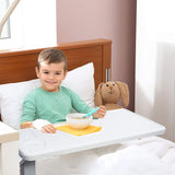 Child using the Vaunn Medical Heavy Duty Overbed Bedside Table